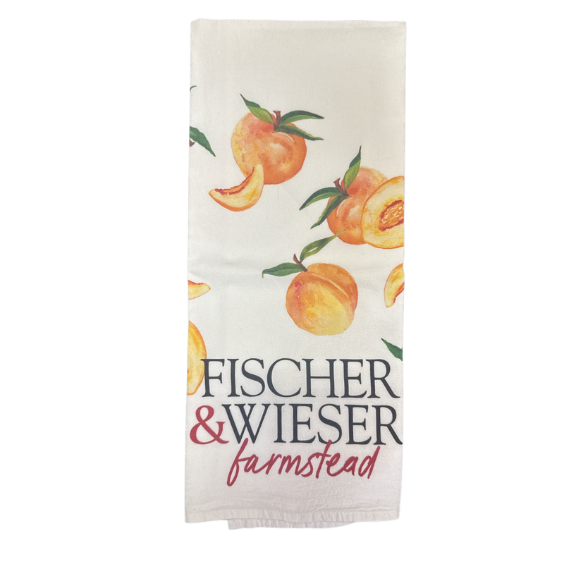 Tea towel with peach design and 'Fischer & Wieser Farmstead' text on a white background