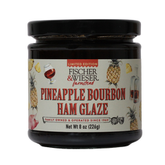 Jar of Pineapple Bourbon Ham Glaze with label on a white background