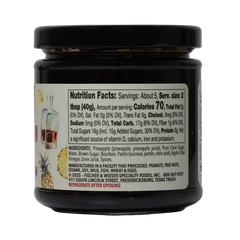Jar of Pineapple Bourbon Ham Glaze with label on a white background